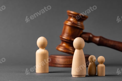 Preview: Wooden toy family and judge mallet. Family divorce concept