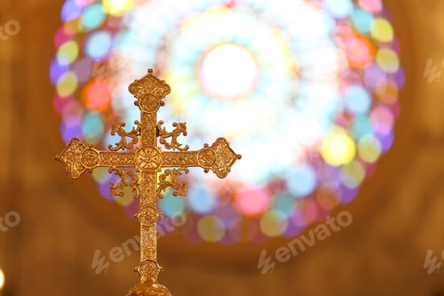 Preview: The cross standing on christian church and flare background.