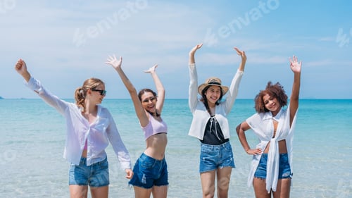 Preview: Happy children laughing and enjoying at beach. Teenage playing with friends at the sea.