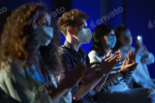 Preview: Group of people clapping while listening to presentation at conference, coronavirus concept