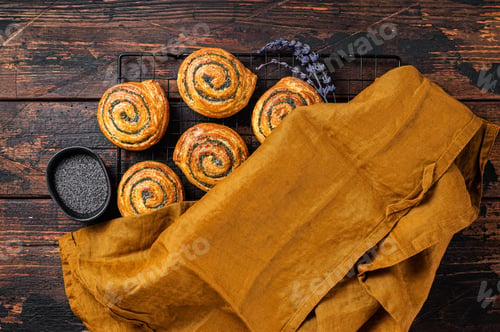 Preview: Sweet roll poppy seed buns with lavender ready for cooking. Wooden background. Top view