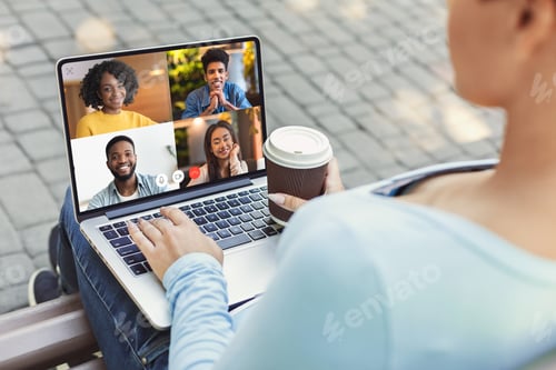 Preview: Woman Calling Distant Friends Making Video Call On Laptop Outdoors