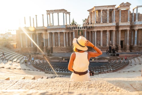 Preview: Roman Ruins of Merida, a young tourist in a dress visiting the Roman Theater. Extremadura, Spain