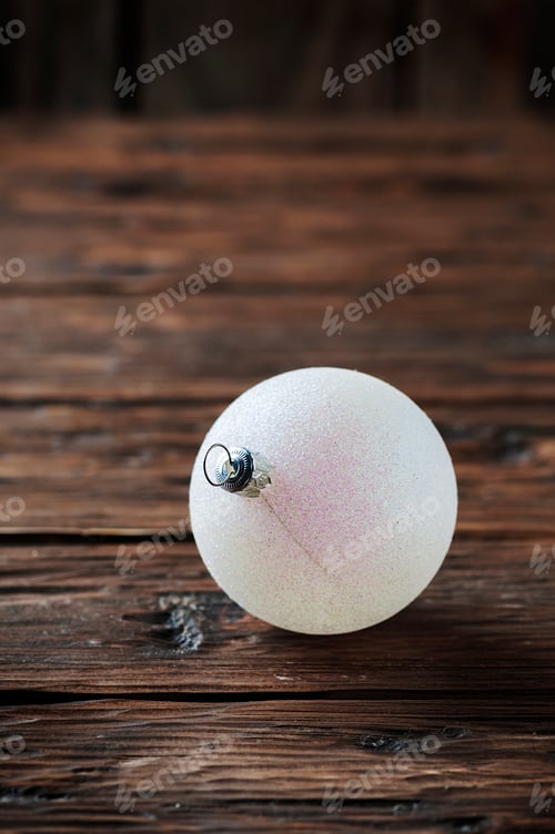 Preview: White christmas balls on the wooden table