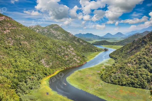 Preview: Captivating view of the Crnojevic river bend around green mountain peaks on a sunny day.