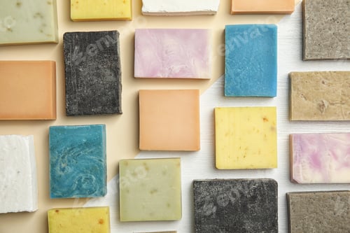 Preview: Hand made soap bars on color background, top view