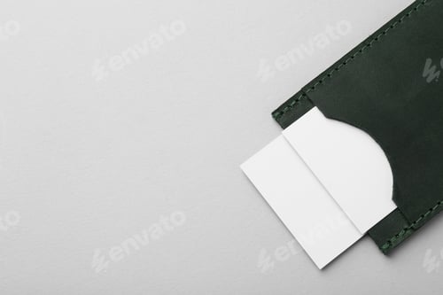 Preview: Leather business card holder with blank cards on light grey background, top view. Space for text
