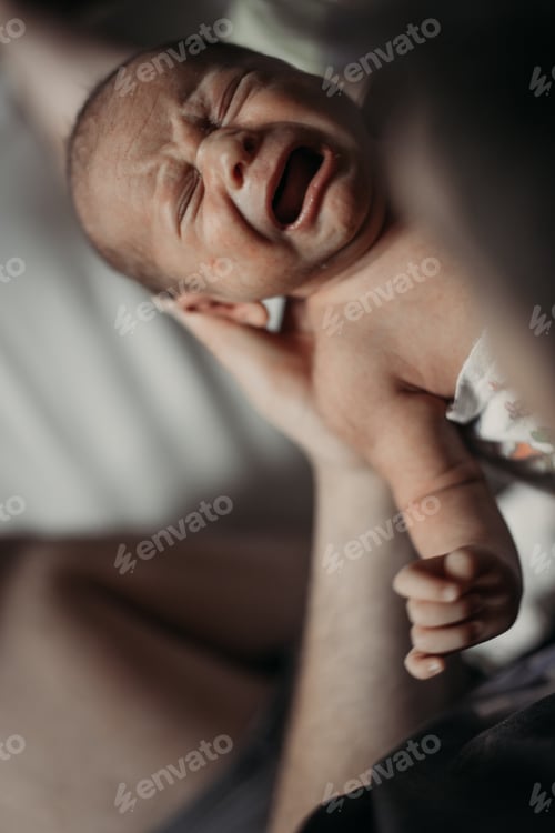 Preview: newborn crying in daddy's arms