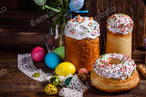 Preview: Easter cake and colorful eggs on a dark background