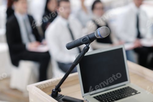 Preview: Business Laptop And Microphotone At Podium On Seminar Conference Education