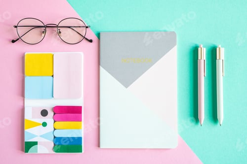 Preview: Overview of notebook, two pens, eyeglasses and set of office supplies