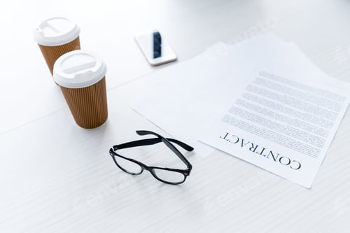 Preview: composition with eyeglasses and business documents on white desk