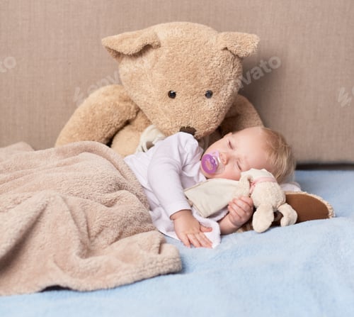 Preview: Sleeping angel. Shot of an adorable baby girl sleeping with her toys.