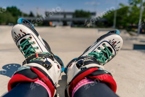 Preview: close-up of roller skates on background of a skate park a street athlete rests after a competition