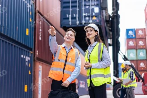 Preview: Caucasian business man and woman worker working in container terminal.