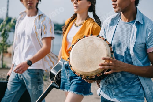 Preview: Street buskers walking and performing on sunny city street