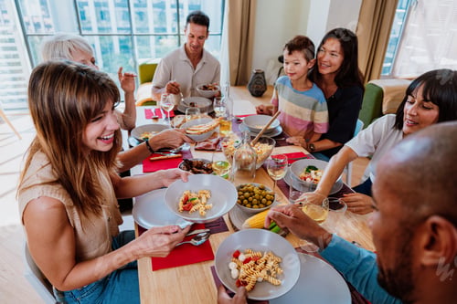 Preview: Family and friends reunion at home. Friends and family sharing a meal together at home