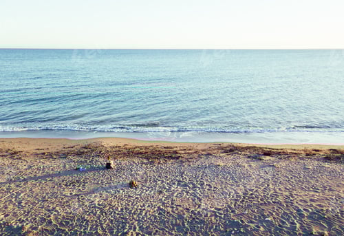 Preview: Aerial views of a girl with her dog at a virgin beach, in Natural park Punta Entinas, Almeria, Spain