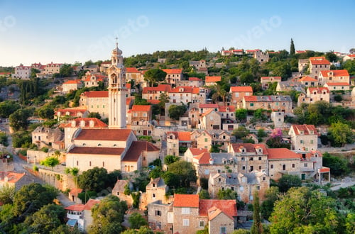 Preview: Croatia. Old town as a background. Houses on the mountain hill during sunset.