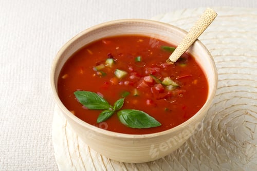 Preview: Bowl of Cold Gazpacho Soup with Golden Spoon