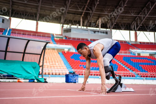 Preview: Asian para-athletes disabled with prosthetic blades running at stadium.