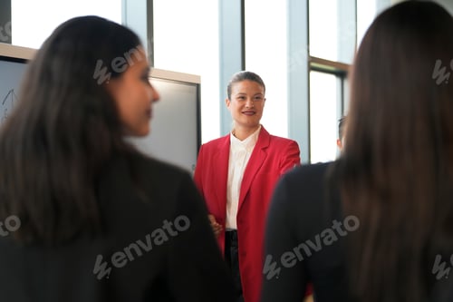 Preview: Diverse business team in a modern office meeting, presenting ideas with confidence and collaboration