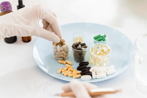 Preview: Healthcare pills held by nutritionist assisting patient in daily diet planning