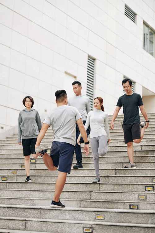 Preview: Sportsmen stretching hips