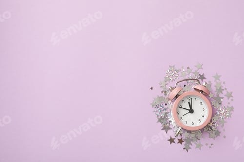 Preview: Pink watch on a festive background with sparkles.
