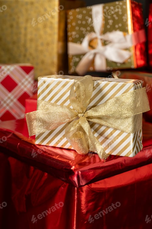 Preview: A lot of wrapped gift boxes. Red, white and golden color