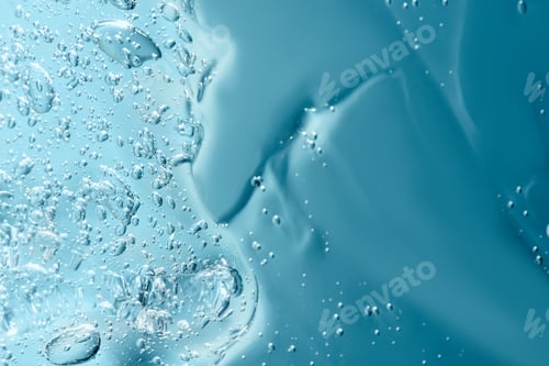 Preview: Close up macro Aloe vera gel cosmetic texture blue background with bubbles