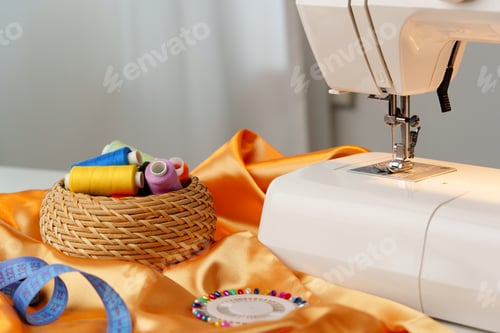 Preview: Sewing machine in use on a wooden table, stitching a light fabric in a well-lit indoor workspace