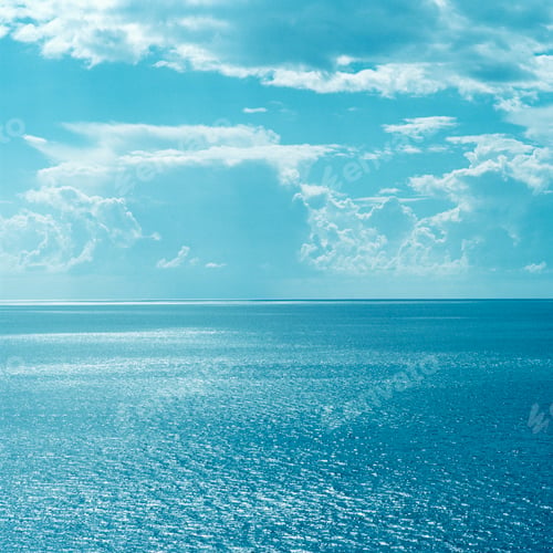 Preview: Clouds over still ocean waters