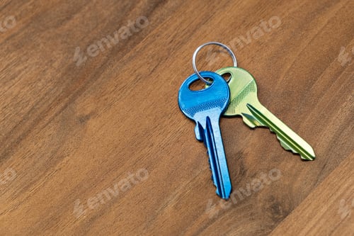Preview: keys on wooden table background. rent sell buy apartment estate business