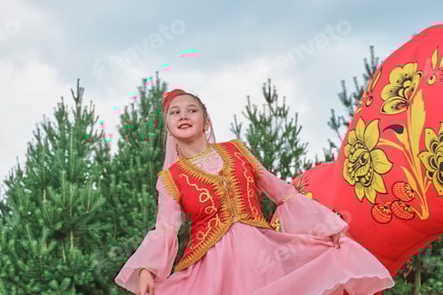 Preview: Young smiling Asian dancing girl in skullcap and traditional ethnic Tatar clothes