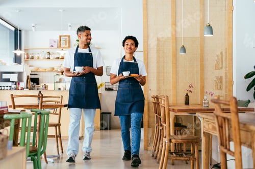 Preview: Barista and waiter working in a bar cafeteria shop