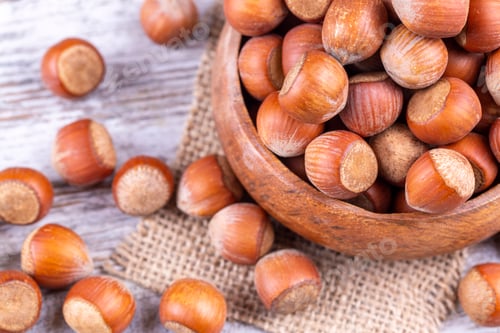 Preview: Shelled Hazelnuts is important for health on the wooden background
