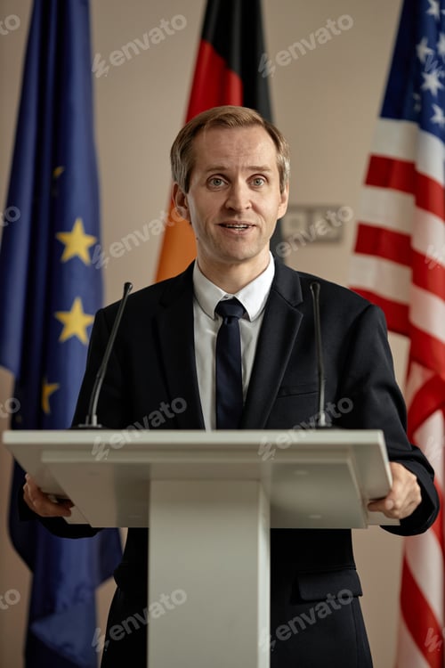 Preview: Portrait of Middle Aged Caucasian Man Answering Question at Political Forum