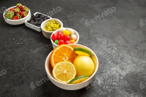 Preview: side close-up view appetizing fruits and berries white bowls of citrus fruits strawberries and