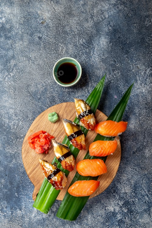 Preview: Sushi and rolls sets Japonese food. top view gray background