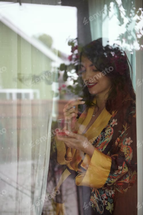 Preview: Brunette Woman Smoking THC CBD Marijuana Joint in Window