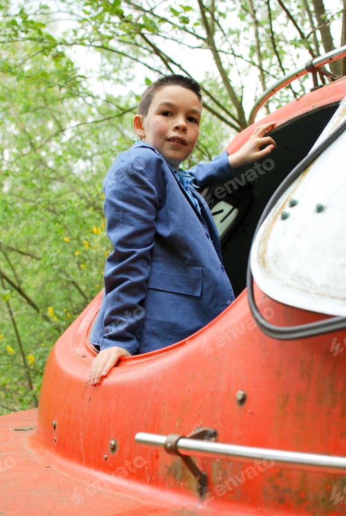 Preview: Cool boy of generation Z with red spaceship- attitude portrait costume pose smile emotion
