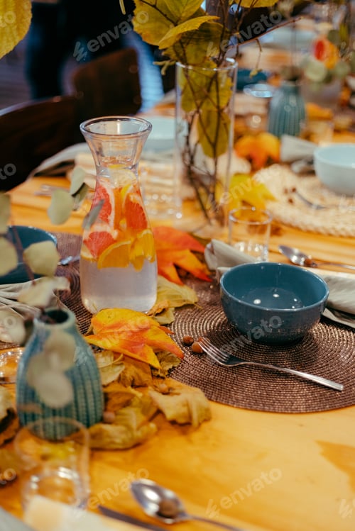 Preview: Vertical shot of a colorful table set and a grapefruit lemonade.