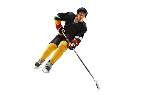 Preview: Ice hockey player in action isolated on white.