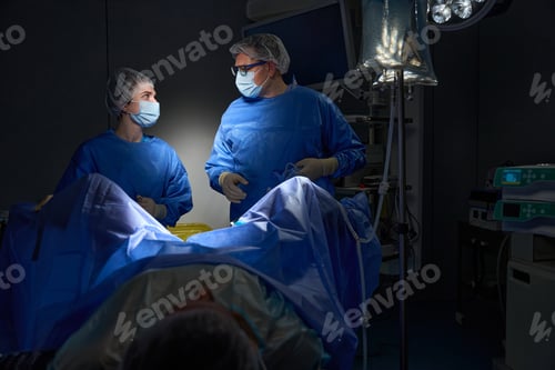 Preview: Surgeons team preforming operation uterus removal in hospital operating theater