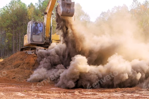 Preview: Heavy machinery clears land, creating dust debris during construction at land preparation