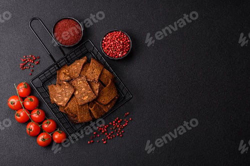 Preview: Crispy homemade brown bread chips with seeds and grains, salt, spices