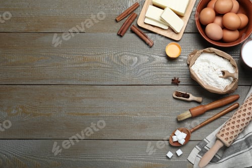 Preview: Cooking utensils and ingredients on wooden table, flat lay. Space for text