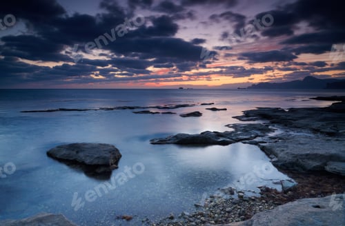 Preview: Colorful summer seascape. rocky coast at sunset