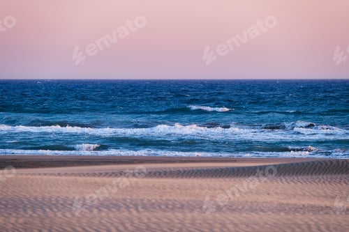 Preview: Sand dunes and seashore during sunset. Summer landscape in the desert.